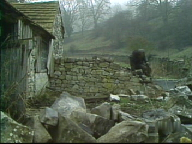 The wall gives way as the ailing Charles leans too heavily on it