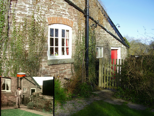 The rear of the farmhouse from which Tom emerges in the first series first series Survivors' episode Gone Away